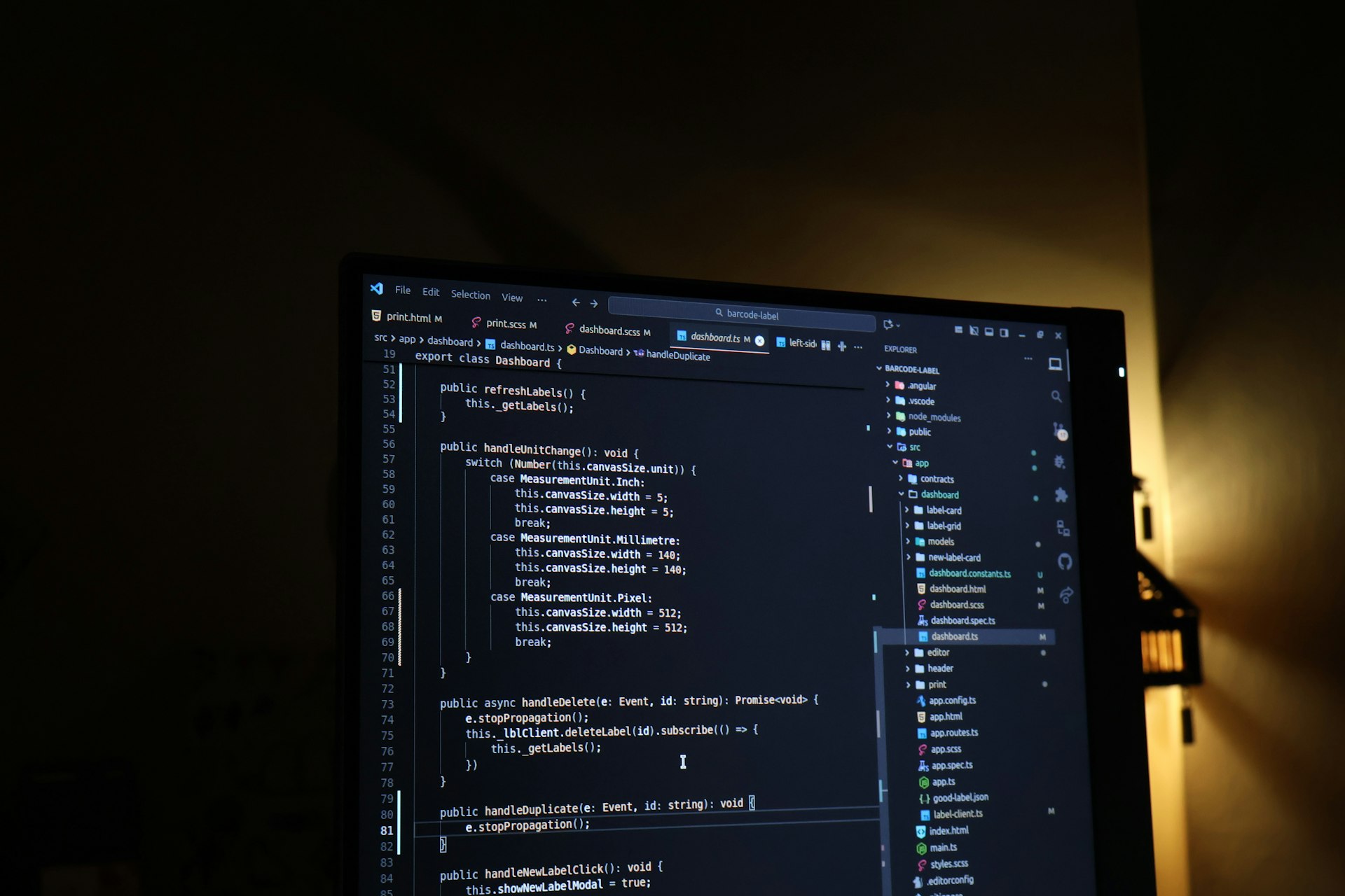 Code editor glowing in a dark room — the terminal is where the work happens